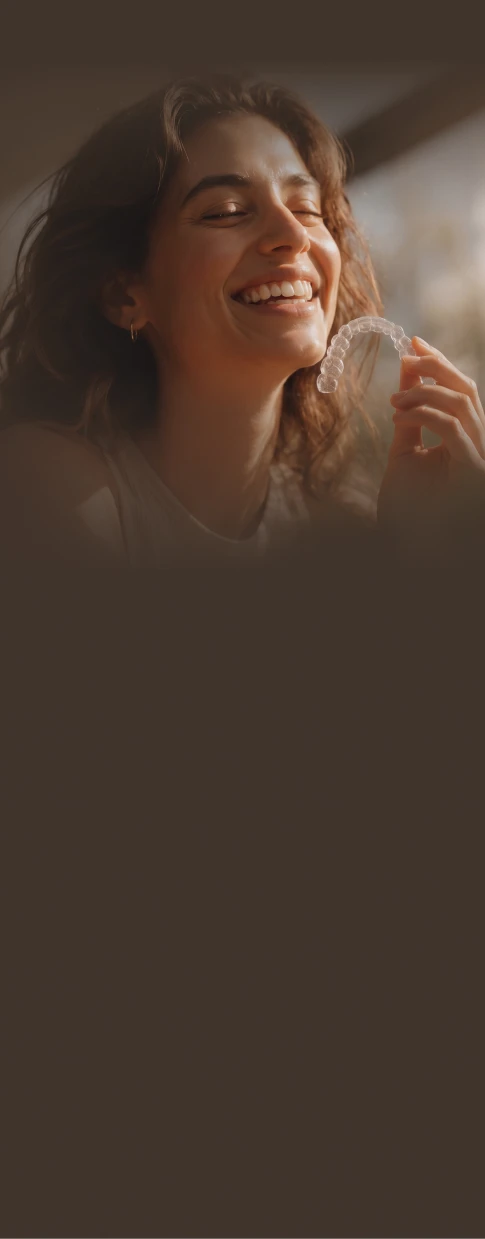 Patient enjoying golden-hour light with a clear aligner